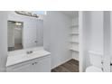 The well-lit bathroom is equipped with a modern vanity, updated fixtures, and built-in storage for convenience at 320 E Mckellips Rd # 204, Mesa, AZ 85201