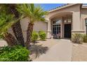 Home front porch featuring desert landscaping and an elegant front door at 2550 E Amberwood Dr, Phoenix, AZ 85048