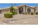 Beige single-story home featuring desert landscaping at 2550 E Amberwood Dr, Phoenix, AZ 85048