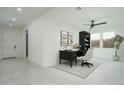Bright, open living area staged with modern desk, chair and shelves at 2732 N 217Th Ave, Buckeye, AZ 85396