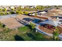 Overhead view of the community park featuring a playground and sand volleyball court at 12599 W Mountain View Dr, Avondale, AZ 85323