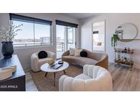 Inviting living room featuring a modern design, plush seating, and a view from large windows at 3131 N Central Ave # 6011, Phoenix, AZ 85012
