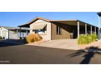 Charming single-story home with carport and manicured landscaping at 8103 E Southern Ave # 24, Mesa, AZ 85209