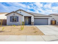 Charming single-story home featuring a two car garage and low maintenance desert landscaping at 17463 N 66Th Ave, Glendale, AZ 85308