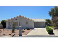 Charming single-story home featuring a well-maintained yard and a two-car garage at 2101 S Meridian Rd # 47, Apache Junction, AZ 85120