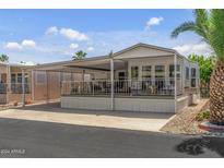 Charming single-story home with covered porch and well-maintained landscaping at 17200 W Bell Rd # 624, Surprise, AZ 85374