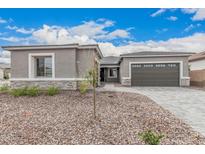 Charming single-story home with a two-car garage and low-maintenance desert landscaping at 4735 W Stargazer Pl, Laveen, AZ 85339