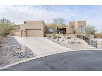 Stunning desert home with attached garage and steps up to the elevated entry at 18315 W Santa Alberta Ln, Goodyear, AZ 85338