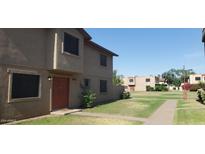 Charming two-story home with well-maintained lawn and walkway at 4032 W Reade Ave, Phoenix, AZ 85019