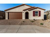 One-story house with brown garage door and red shutters at 40532 W Wade Dr, Maricopa, AZ 85138