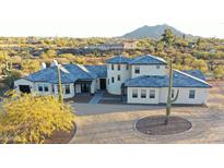 Custom home with barrel tile roof and charming desert landscape at 6737 E Rockaway Hills Dr, Cave Creek, AZ 85331
