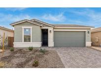 One-story house with green exterior, two-car garage, and landscaped front yard at 40115 W Elm Dr, Maricopa, AZ 85138