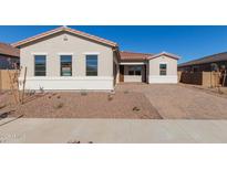 Single-story home with a brick driveway and neutral color scheme at 16372 W Avenida Del Sol --, Surprise, AZ 85387