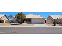 Single-story home with a two-car garage and desert landscaping at 2605 N 133Rd Ave, Goodyear, AZ 85395