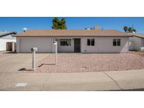 Charming single-story home with a well-maintained exterior and desert landscaping, plus an attached one car garage at 3222 W Wagoner Rd, Phoenix, AZ 85053