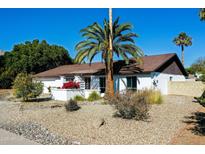 Single-story home with landscaped yard and mountain views at 2320 E Shangri La Rd, Phoenix, AZ 85028