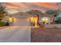 One-story home with a two-car garage and landscaped front yard at 3932 N Silver King Ln, Casa Grande, AZ 85122
