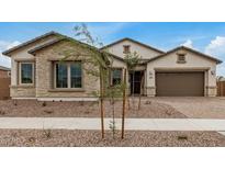 Charming single-story home featuring stone accents, neutral stucco, and a well-manicured front yard at 19679 E Estrella Rd, Queen Creek, AZ 85142