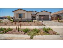 Charming single-story home featuring desert landscaping, a paved driveway, and a neutral color palette at 17225 W Calle Lejos --, Surprise, AZ 85387