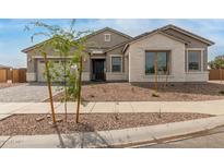 Charming single-story home showcasing a stone facade and well-maintained landscaping in a peaceful neighborhood at 19539 E Estrella Rd, Queen Creek, AZ 85142