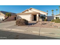 House exterior featuring a two-car garage and desert landscaping at 5730 E Holmes Ave, Mesa, AZ 85206