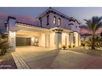Stunning two-story home with a three-car garage and landscaped front yard at 3799 S Skyline Dr, Gilbert, AZ 85297