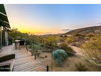 Stunning deck with mountain views and outdoor seating at 9556 E Celestial Dr, Scottsdale, AZ 85262