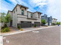 Charming two-story townhome with modern design, stone accents, and attached two-car garage at 3741 E Catalina Dr, Phoenix, AZ 85018