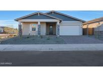 One-story home with gray exterior, stone accents, and a two-car garage at 13567 W Steed Ridge Rd, Peoria, AZ 85383