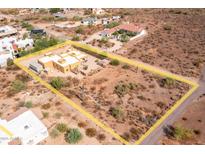 Aerial view showing a single-story home with surrounding desert landscape at 323 W Quartz Rock Rd, Phoenix, AZ 85085