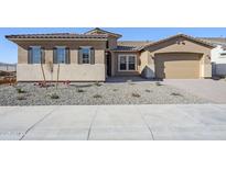 New construction home with a two-car garage and desert landscaping at 6722 N 190Th Dr, Waddell, AZ 85355