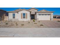 Single-story home with a two-car garage and landscaped front yard at 19014 W Ocotillo Rd, Waddell, AZ 85355