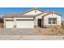 Charming single-story home featuring a three-car garage, desert landscaping, and a welcoming entrance at 11934 W Parkway Ln, Avondale, AZ 85323