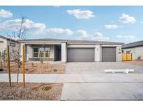 New construction home with three-car garage and desert landscaping at 22886 E Alyssa Rd, Queen Creek, AZ 85142