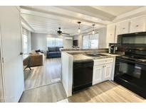 Bright kitchen view with stainless steel appliances, countertops, and an open floor plan at 318 S Crismon Rd # 10, Mesa, AZ 85208