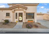 Inviting curb appeal with landscaped front yard and welcoming entryway at 15603 N 79Th N Dr, Peoria, AZ 85382