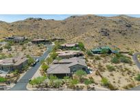 Expansive aerial view of desert homes with tile roofs nestled in a scenic, mountainous desert community at 8006 S 38Th Pl, Phoenix, AZ 85042