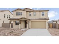 Charming two-story home with desert landscaping, a covered porch, and a two car garage at 2957 E Cherry Hill Dr, Gilbert, AZ 85298