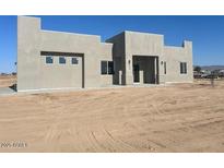 Stunning single-story home with modern architecture and neutral-colored stucco finish at 504 N 297Th Ln, Buckeye, AZ 85396