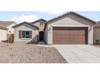 Charming single-story home featuring a two-car garage and low maintenance desert landscaping at 2851 N Coronado Dr, Florence, AZ 85132