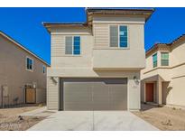 Two-story home featuring a two-car garage, neutral stucco, and a concrete driveway at 4512 S Mole --, Mesa, AZ 85212
