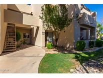 Exterior view of condo building with walkway and landscaping at 11333 N 92Nd St # 2028, Scottsdale, AZ 85260