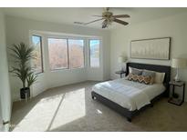 Bright bedroom with large windows and a comfortable bed at 19661 N Echo Rim Dr, Surprise, AZ 85387