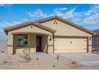 Charming single-story home with a two-car garage and low-maintenance desert landscaping at 6468 S 246Th Ln, Buckeye, AZ 85326