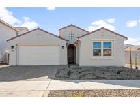 Single-story home with attached garage and neutral color palette at 1291 W Treasure Trl, Apache Junction, AZ 85120