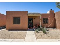 Charming home with a walkway leading to a covered front porch and decorative touches at 15601 N 27Th St # 7, Phoenix, AZ 85032