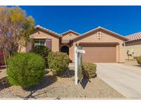 Charming single-story home with a well-maintained yard and a two-car garage, perfect for suburban living at 22882 E Marsh Rd, Queen Creek, AZ 85142