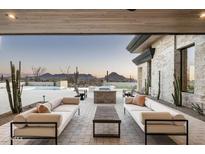 Relaxing patio with fire pit, seating, and mountain views at 28805 N 114Th St, Scottsdale, AZ 85262