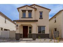 Two-story home boasts a private entrance, tile roof, and fresh xeriscaping for low maintenance at 15598 S 181St Dr, Goodyear, AZ 85338