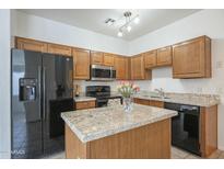 Kitchen with granite countertops and stainless steel appliances at 1718 W Colter St # 195, Phoenix, AZ 85015